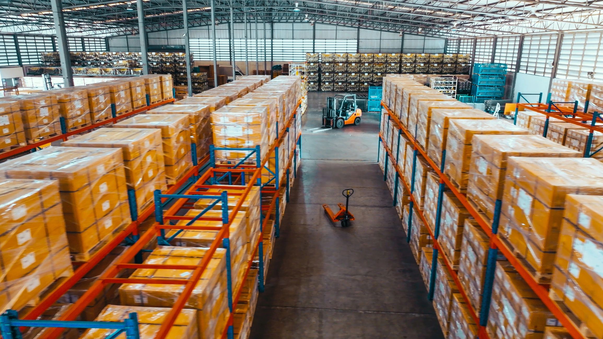 Warehouse shelves and packaged goods representing logistics and industrial supply chains